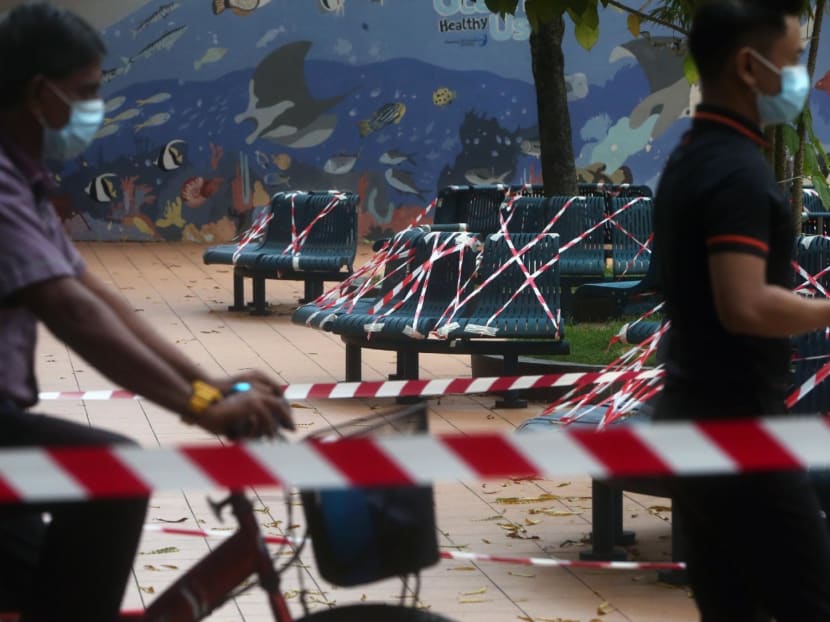 Benches at a public housing estate were cordoned off with tape as part of infection controls against Covid-19 during a semi-lockdown in April 2020. 