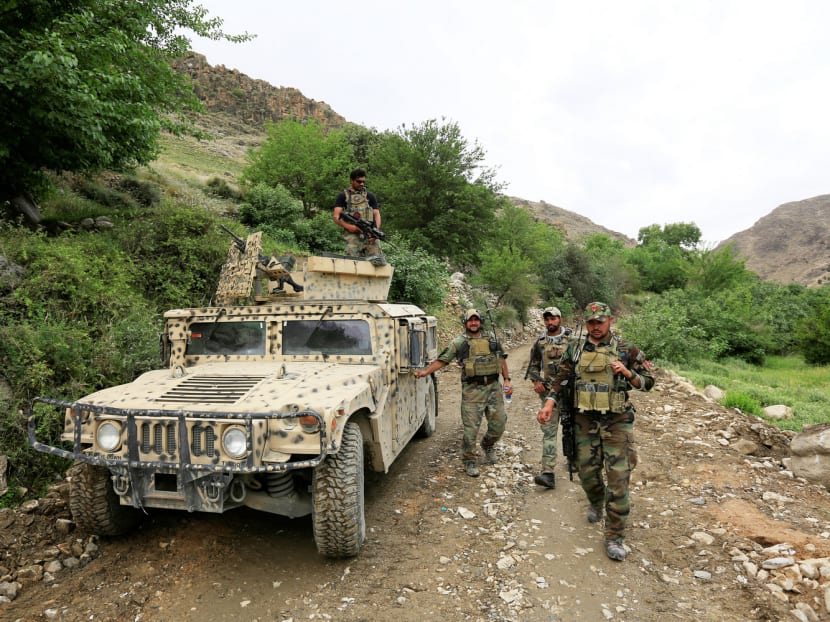 Afghan Special Forces patrolling Achin district in the eastern province of Nangarhar, Afghanistan, last Sunday, after the US dropped a MOAB bomb, its largest non-nuclear explosive device. Photo: Reuters