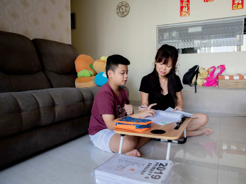Ms Desiree Yaw and her son Dillon Tan, 12, who will be taking the Primary School Leaving Examination (PSLE) under the new scoring system in 2021.