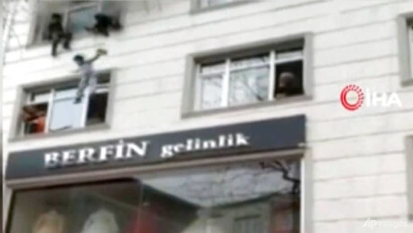 Woman drops kids from window to save them from fire in Istanbul