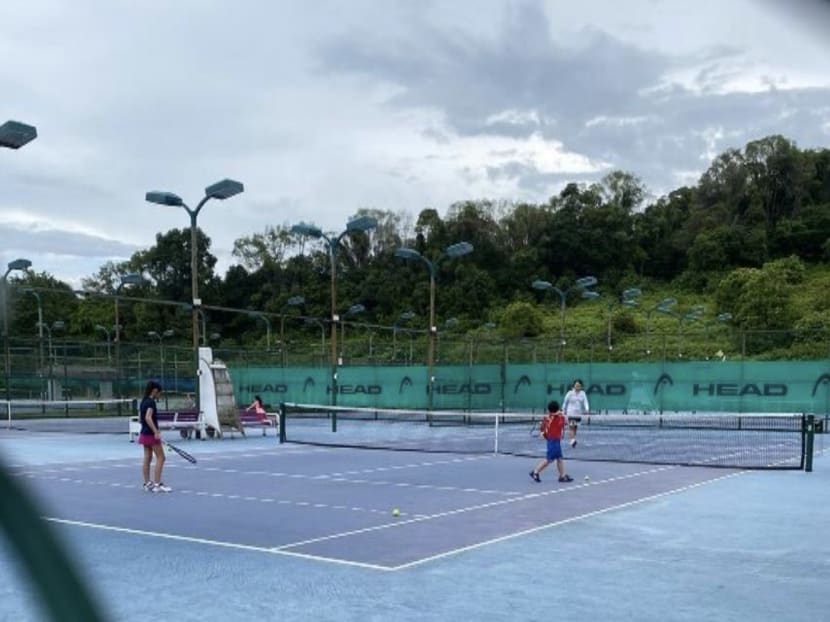 A group of people playing tennis at the Tanglin Tennis Academy on Turf Club Road were fined.