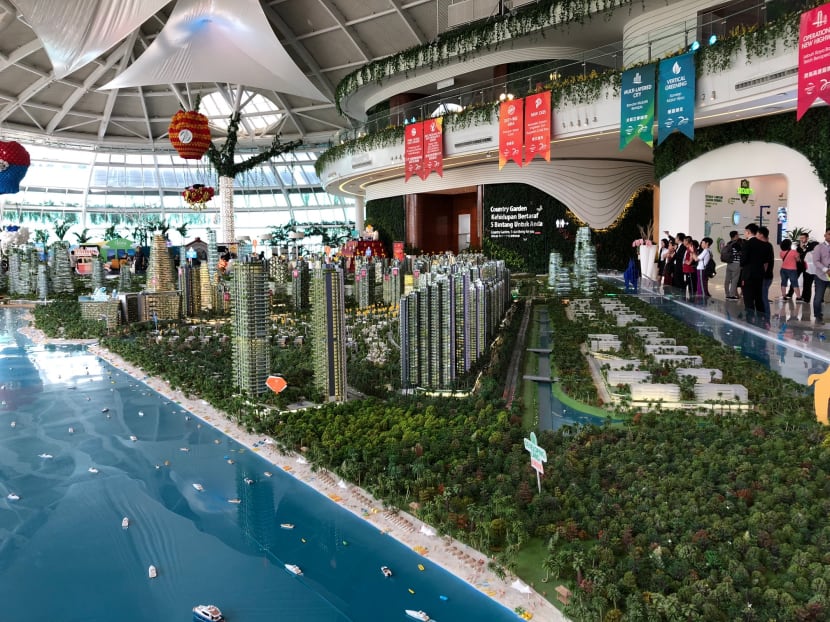 Visitors, many of them from China, are shown around the sales gallery of Forest City, a sprawling US$100 billion (S$133.3 billion) development in Johor, Malaysia.