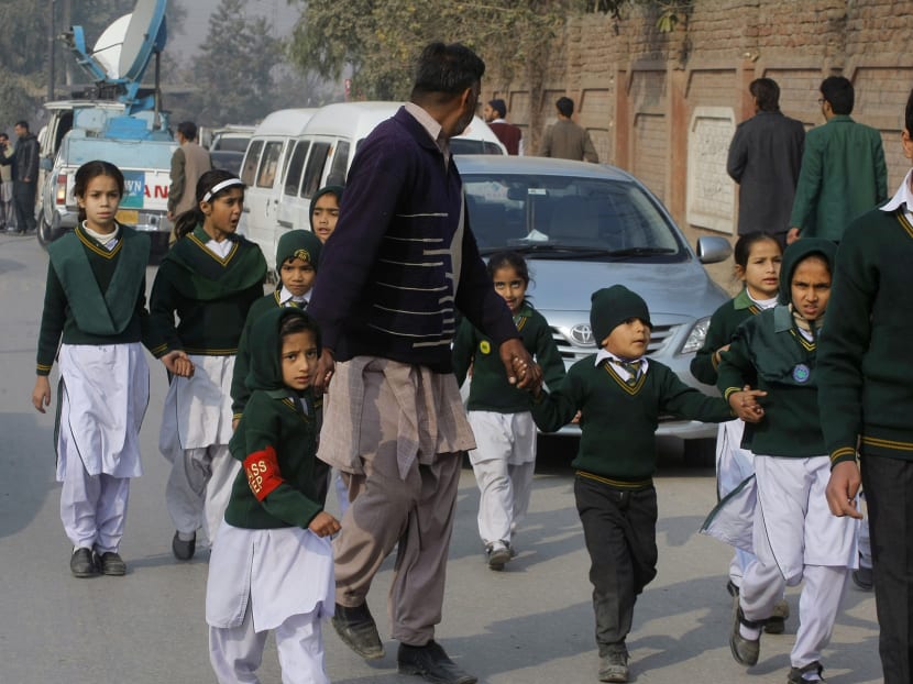 Gallery: Taliban attack Pakistani school, kill at least 84