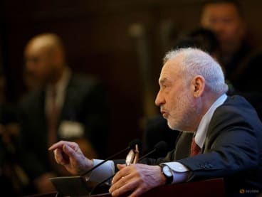 FILE PHOTO: Columbia University Professor Joseph Stiglitz speaks at the China Development Forum in Beijing, China March 24, 2019. REUTERS/Thomas Peter/Pool/File Photo