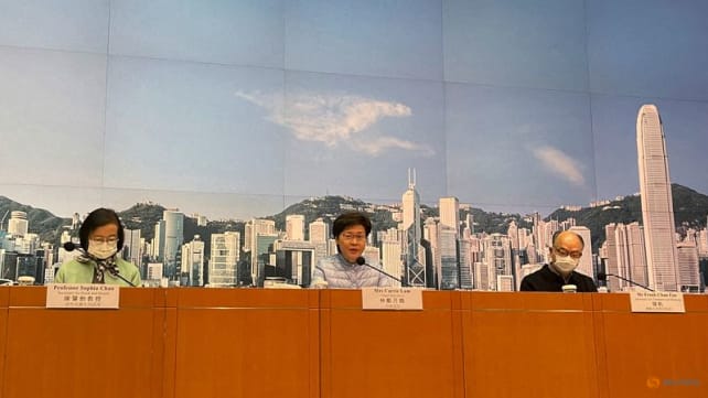 Fighting COVID-19, solemn-faced Hong Kong leader explains maskless appearances