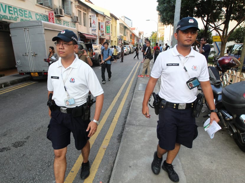 Policemen patrolling Little India the day after the Little India Riots. Photo by Don Wong, 09 Dec 2013.