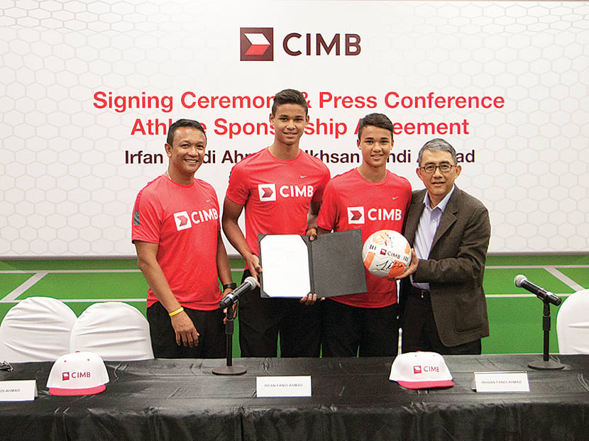 From right: CIMB Bank Singapore CEO Mak Lye Mun, Ikhsan, Irfan and Fandi during the signing ceremony. The year-long sponsorship worth a ‘six-figure’ sum begins today. Photo: CIMB Singapore
