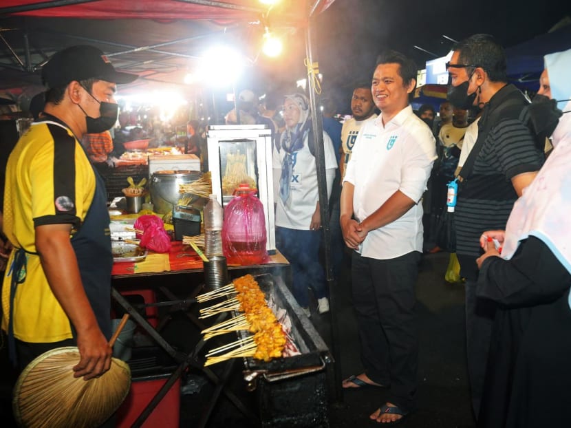 Mr Abdul Rahim Tahir, the Gerakan Tanah Air candidate in Tambun, on a visit to a night market on Nov 5, 2022. Mr Abdul Rahim Tahir, the Gerakan Tanah Air candidate in Tambun, on a visit to a night market on Nov 5, 2022.