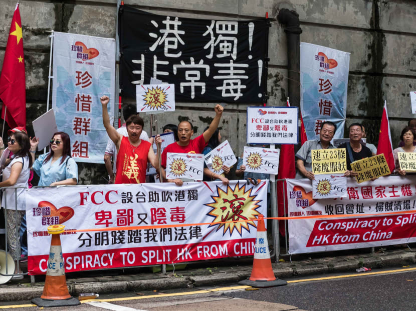 Protesters outside the Foreign Correspondents' Club in Hong Kong on Tuesday (Aug 14)