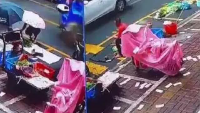 中国男子分手后想不开 卖金饰当街撒钱 