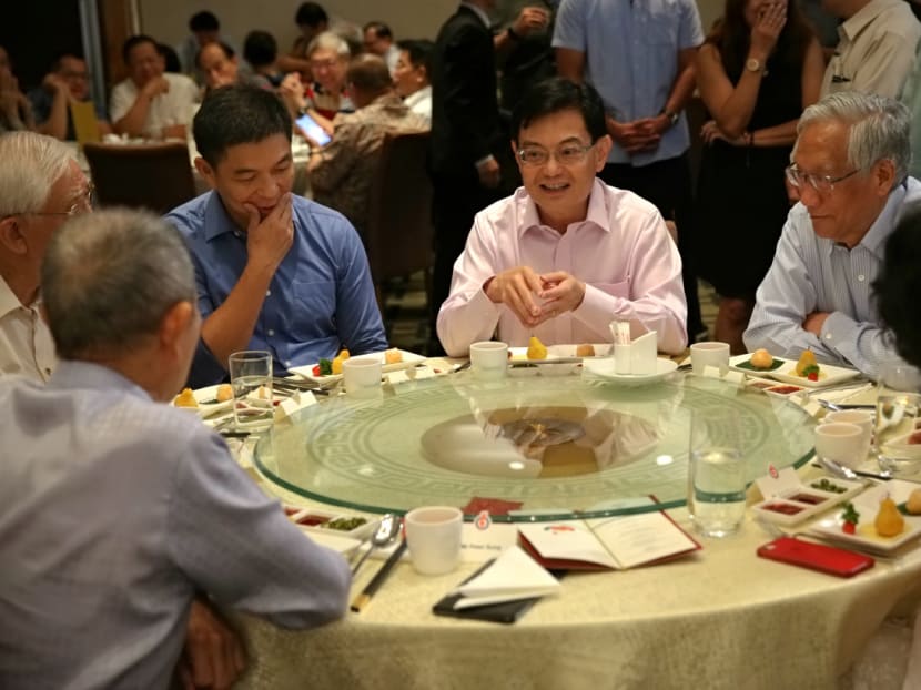Deputy Prime Minister Heng Swee Keat and Speaker of Parliament Tan Chuan-Jin with current and former People’s Action Party MPs.
