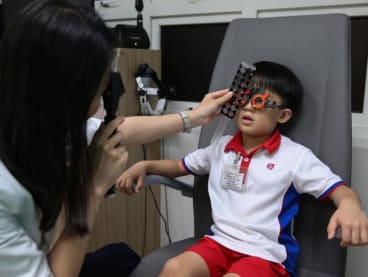 <p>A boy undergoing an eye check at the Singapore National Eye Centre’s Myopia Centre at Block 212 along Bedok North Street 1,&nbsp;on Aug 16, 2019.</p>
