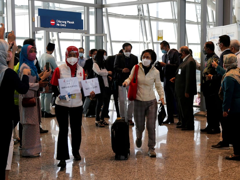 Travellers arrive at the Kuala Lumpur International Airport in Sepang, Malaysia, on Nov 29, 2021.