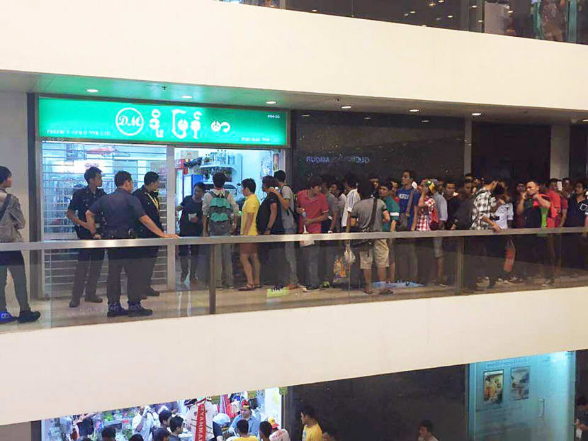 A crowd outside Mr Ye Win Paing’s shop at Peninsula Plaza. Photo: Kyaw Jan Jan Bo