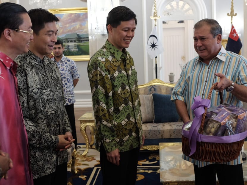 Minister for Social and Family Development Tan Chuan-Jin (left) and Minister in the Prime Minister’s Office Chan Chun Sing (centre) with Johor's Sultan Ibrahim Iskandar (right). Photo: Channel NewsAsia