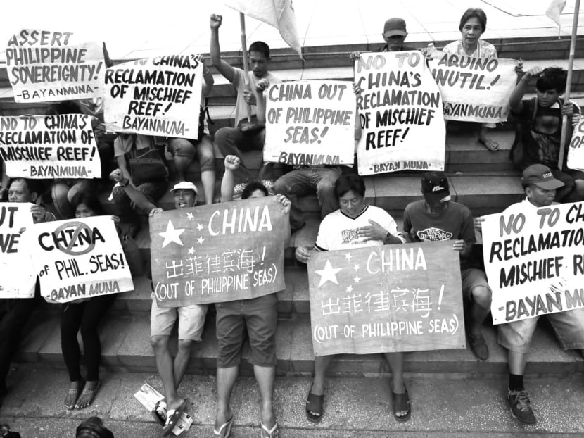 Filipinos protesting on Friday against China’s reclamation activities in disputed waters. Beijing’s rapid reclamation work has increased the risk of flare-ups. Photo: AP