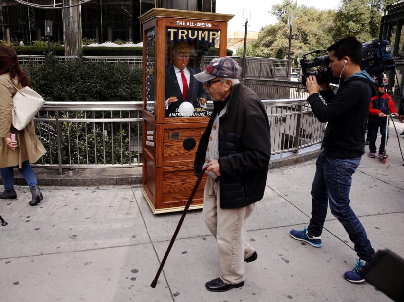 Gallery: Trump fortune-telling doll provokes New York