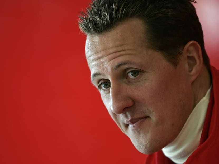 Michael Schumacher of Germany looks on during a news conference at the end of the official presentation of the new Ferrari Formula One race car 248 F1 at the Mugello racetrack in Scarperia, central Italy, in this Jan 24, 2006 file picture. Photo: Reuters
