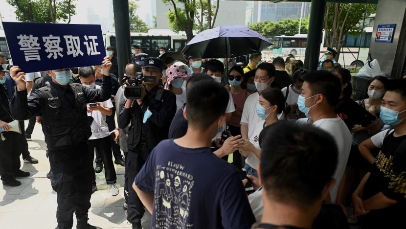 Protesters taken away outside China Evergrande headquarters Protesters taken away outside China Evergrande headquarters