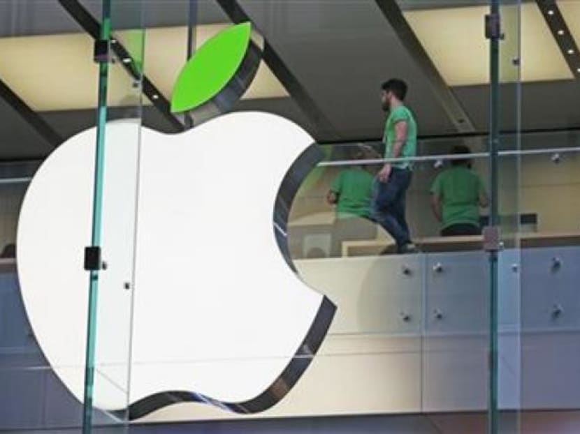 Employees wear green shirts near Apple's familiar logo displayed with a green leaf at the Apple Store timed to coincide with an annual celebration of Earth Day in Sydney on April 22 last year. Photo: AP