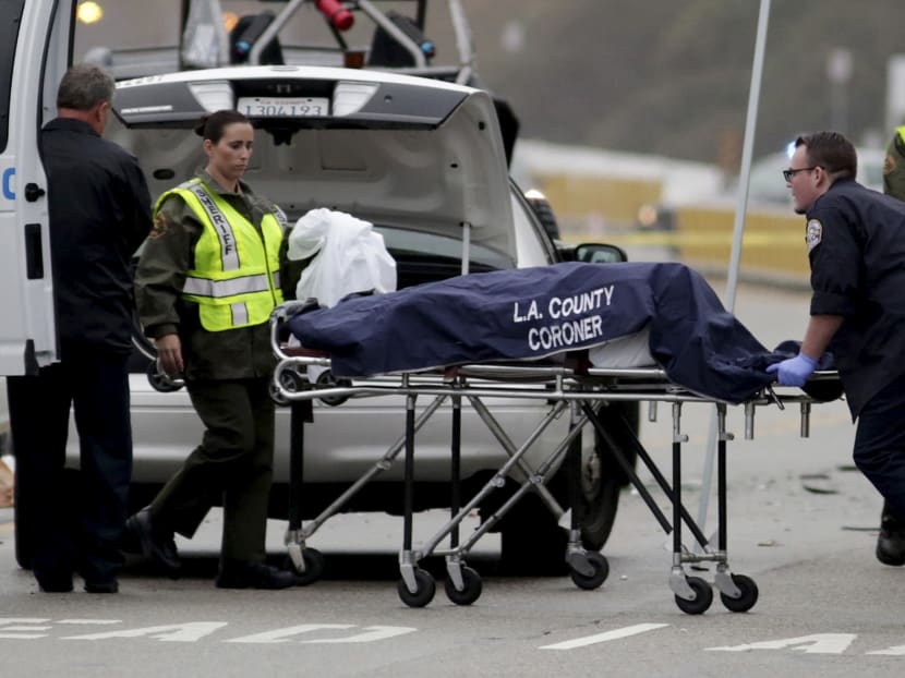 A Los Angeles County coroner worker loads a victim into a van at the scene of a four-car crash involving Olympic gold medalist and reality TV star Caitlyn Jenner, then known as Bruce Jenner, in Malibu, California, in this February 7, 2015 file photo. Photo: Reuters
