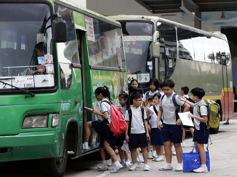 Ngee Ann Primary School students aboard a school bus.