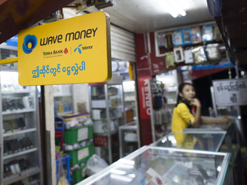 No banks or ATMs? No problem: Myanmar is looking at "mobile money" to ensure quick transactions. Photo: AFP