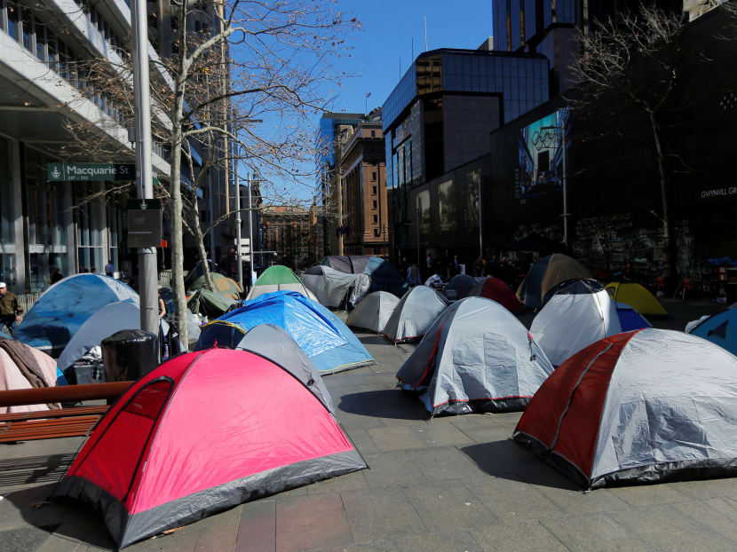 Tents erected by homeless people line the pavement outside the Reserve Bank of Australia (RBA) building in central Sydney. Photo: Reuters