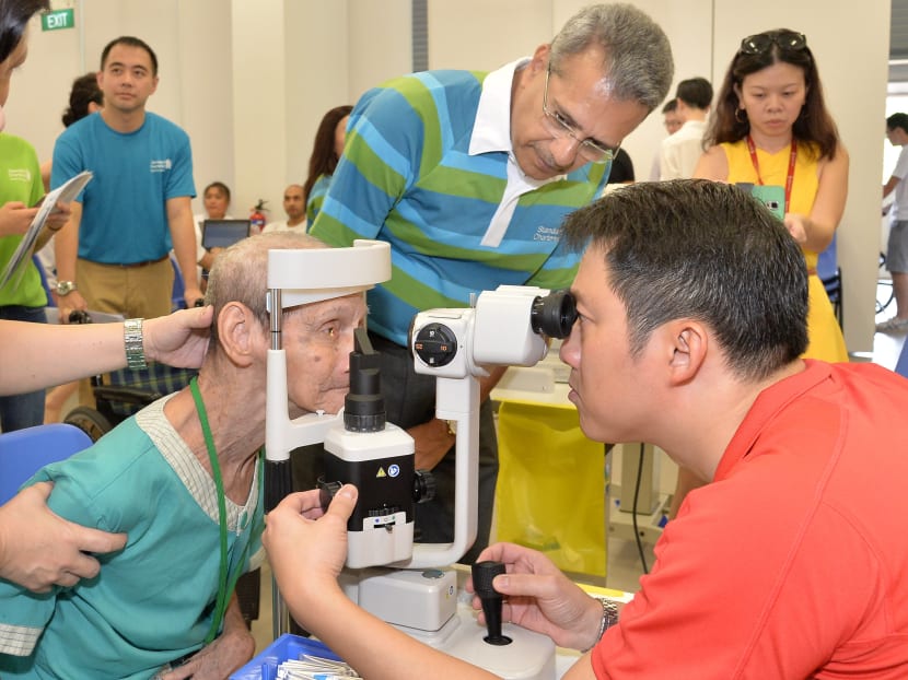 A senior citizen undergoing an eye test at a Mobile Eye Clinic. Photo: Standard Chartered Bank