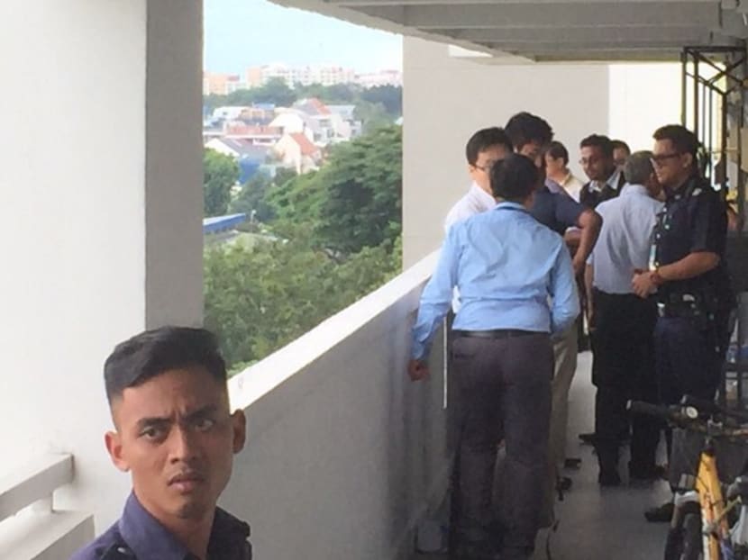 Police outside the Ang Mo Kio flat where a woman was found dead today. Photo: He Xingying/Channel NewsAsia