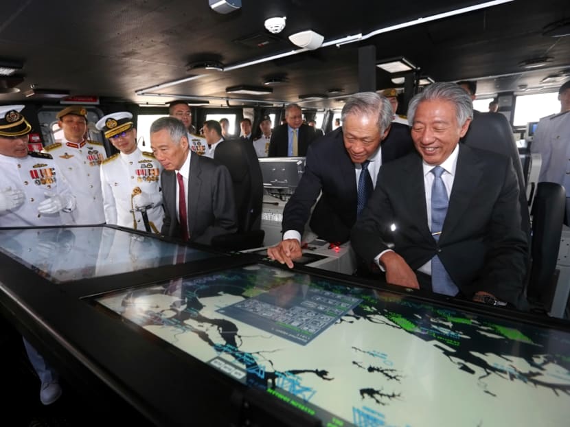 PM Lee, Dr Ng Eng Hen and Mr Teo Chee Hean in the Integrated Command Centre on the newly commissioned LMV RSS Independence. Photo: Nuria Ling/TODAY