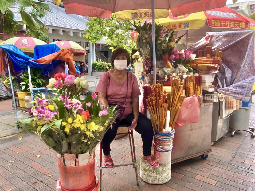 Ms Catherine Teo, 65, said she has been selling flowers and joss sticks outside the Kwan Im Thong Hood Cho Temple in Waterloo Street since she was five years old. Ms Catherine Teo, 65, said she has been selling flowers and joss sticks outside the Kwan Im Thong Hood Cho Temple in Waterloo Street since she was five years old.