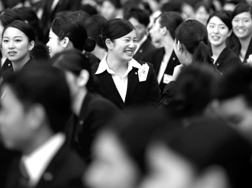 New employees of Japan Airlines at an initiation ceremony in Tokyo last month. The number of working women in Japan has grown by more than 800,000 over the past two years. Bloomberg
