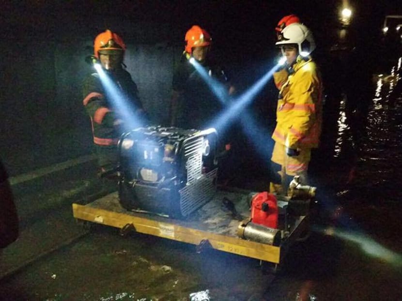 SCDF personnel work to clear a flooded tunnel between Braddell and Bishan MRT stations on Oct 8. Photo: SCDF