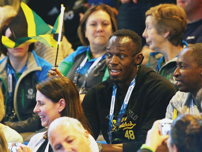 Bolt watching a preliminary round netball match between New Zealand and Jamaica at SECC Precinct in Glasgow on Wednesday. He will begin his campaign in the 4x100m relay heats today. Photo: Getty Images