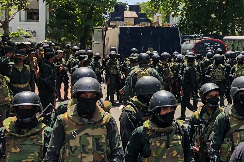 Army soldiers stand guard during an anti-government protest by demonstrators outside the office of Sri Lanka's prime minister in Colombo on July 13, 2022. Army soldiers stand guard during an anti-government protest by demonstrators outside the office of Sri Lanka's prime minister in Colombo on July 13, 2022. 