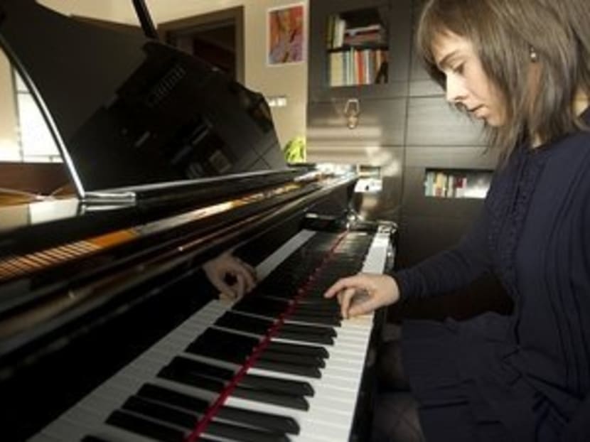 Laia Martin, a Spanish pianist, plays the piano on Dec 26, 2011. Photo: Telegraph