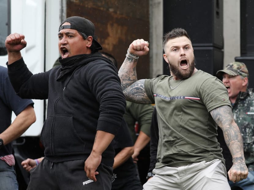 Activists and members of the Freedom and Rights Coalition perform a haka during a protest march to demand an end to Covid-19 restrictions and mandatory vaccination in Christchurch on Nov 13, 2021.