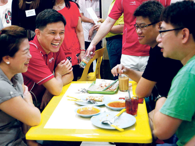 Minister for Social and Family Development Chan Chun Sing (in red) during a ministerial community visit to Woodlands yesterday. 
PHOTO: Wee Teck Hian