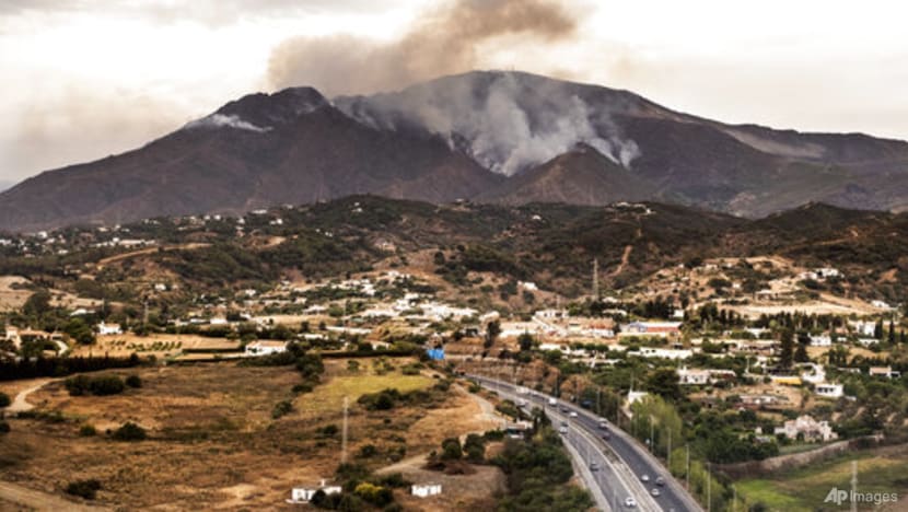 Rainfall helps firefighters control southern Spain's inferno