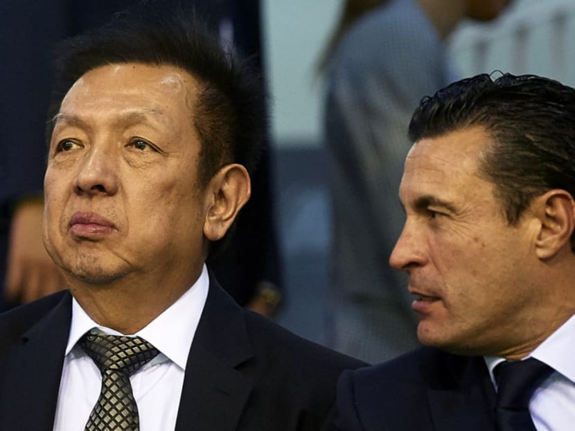 Peter Lim (left), seen here with former Valencia CF president Amadeo Salvvo, was hailed as a hero after buying 70.4% of the near-bankrupt club. Photo: Getty Images