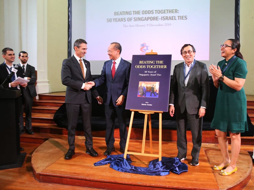 Mr Yeo (in red tie) with Mr Sagi Karni, ambassador of Israel to Singapore; Mr Bilahari Kausikan, former permanent secretary of foreign affairs; and Ms Michelle Teo, acting director of the Middle East Institute, at the book launch on Dec 9.