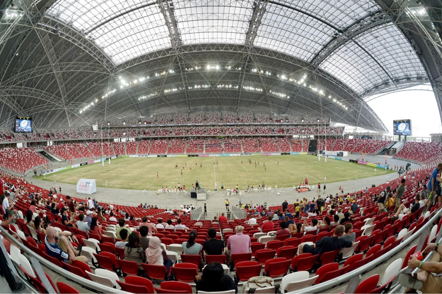 Spectators watching an international rugby tournament at the National Stadium within Singapore Sports Hub in Kallang, after it opened in June 2014.