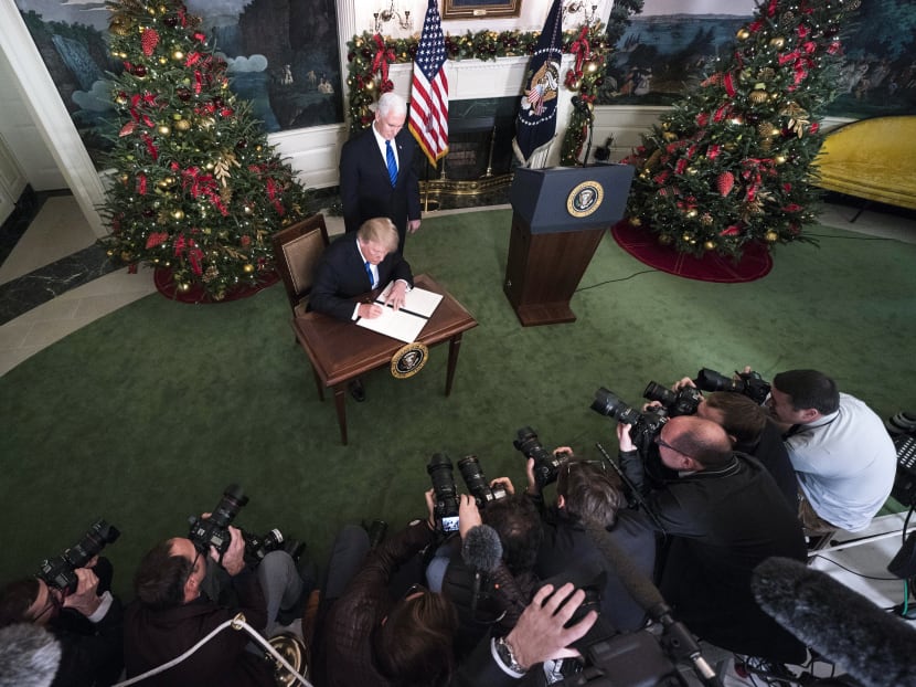 Vice president Mike Pence looks on as President Donald Trump signs a proclamation recognizing Jerusalem as the capital of Israel, in the Diplomatic Reception Room of the White House in Washington, Dec. 6,  2017. Trump's proclamation reversed nearly seven decades of American foreign policy and set in motion a plan to move the U.S. Embassy from Tel Aviv to the fiercely contested Holy City. Photo: The New York Times