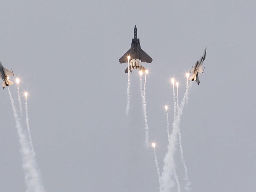 The F-15SG and two F-16Cs in action during the preview of the Singapore Airshow 2018 (SA18) on Feb 2. Photo: Najeer Yusof/TODAY