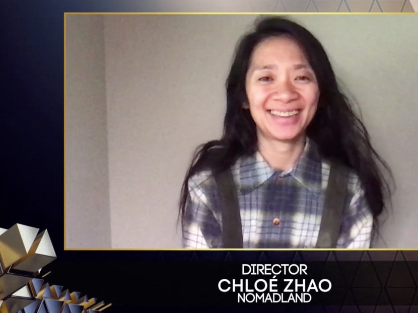 Chinese director Chloé Zhao reacts after winning the award for Best Director for her work on the film Nomadland via a video link during the British Academy Film Awards 'Main Show' at the Royal Albert Hall in London, UK on April 11, 2021.