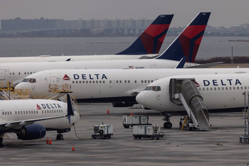Delta Airlines passenger aircrafts are seen on the tarmac of John F. Kennedy International Airport in New York on Dec 24, 2021.