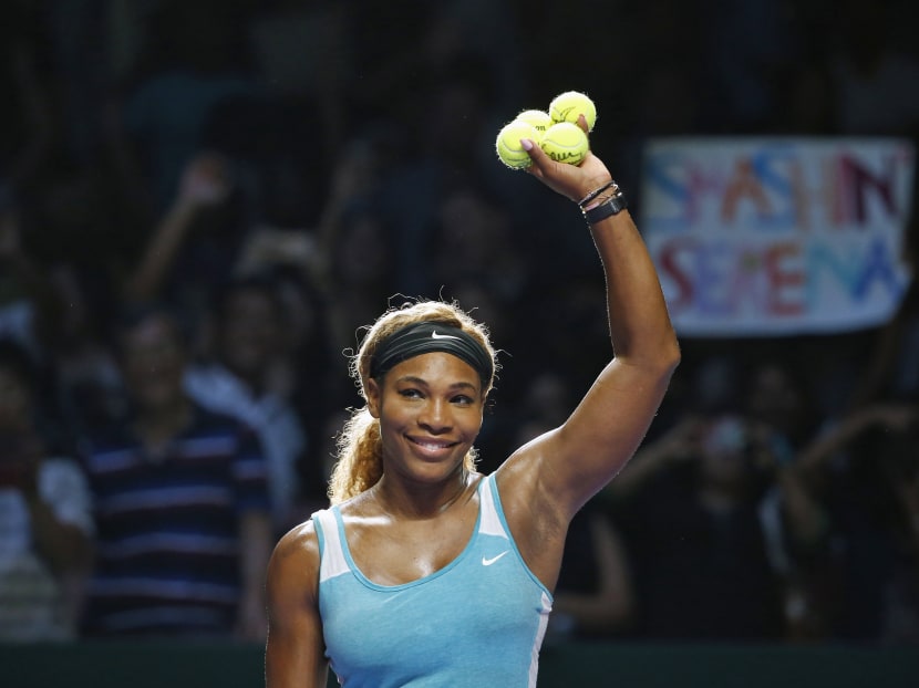 Serena Williams of the US celebrates her win over Caroline Wozniacki of Denmark during their WTA Finals singles semi-finals tennis match at the Singapore Indoor Stadium. Photo: Reuters