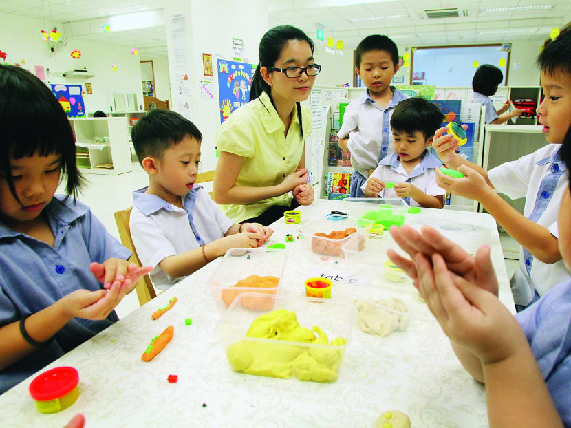 A teacher and kids at play at PCF Sparkletots at Punggol West. Photo: Ooi Boon Keong