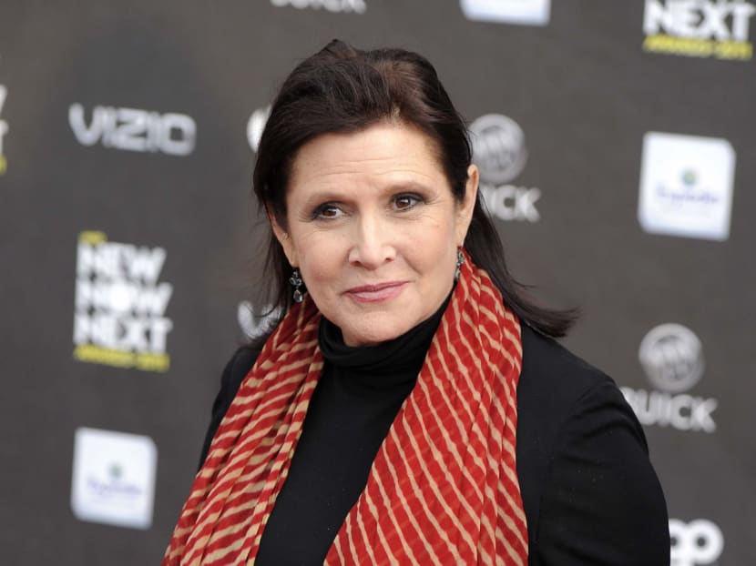 This April 7, 2011 file photo shows Carrie Fisher at the 2011 NewNowNext Awards in Los Angeles. Officials say actress Carrie Fisher died from sleep apnea and a combination of other factors, but they could not conclusively determine what caused her death. AP file photo